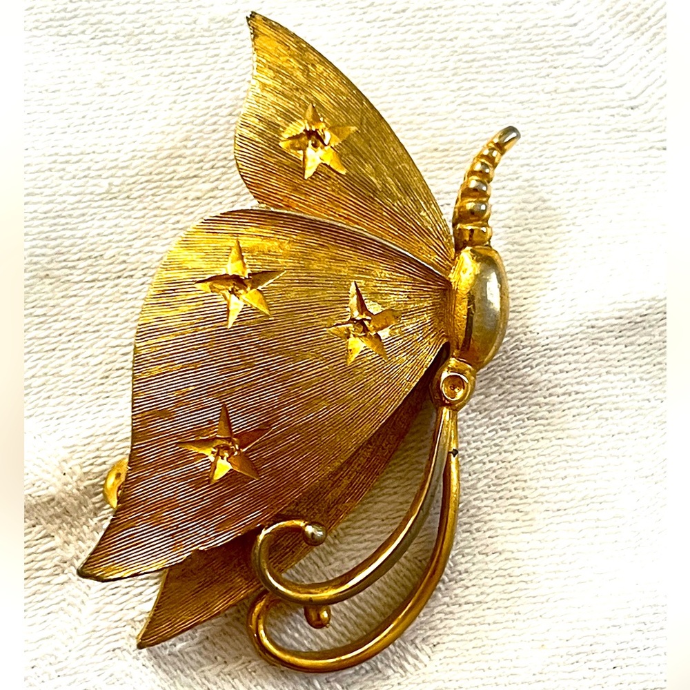 Gold Tone Butterfly Brooch with Star Cutouts by J.J. 1.75” Tall